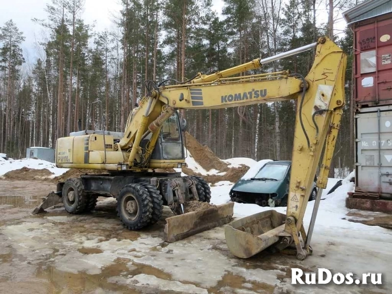 Колесник Komatsu 170, 19 т., 2 ковша, макс. опции фото