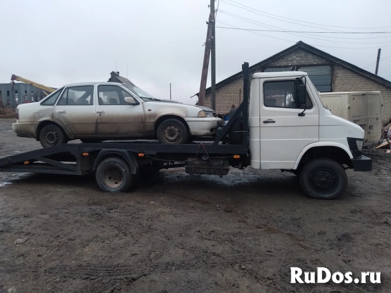 Услуги эвакуатора до 3 тонн ломанная платформа фото